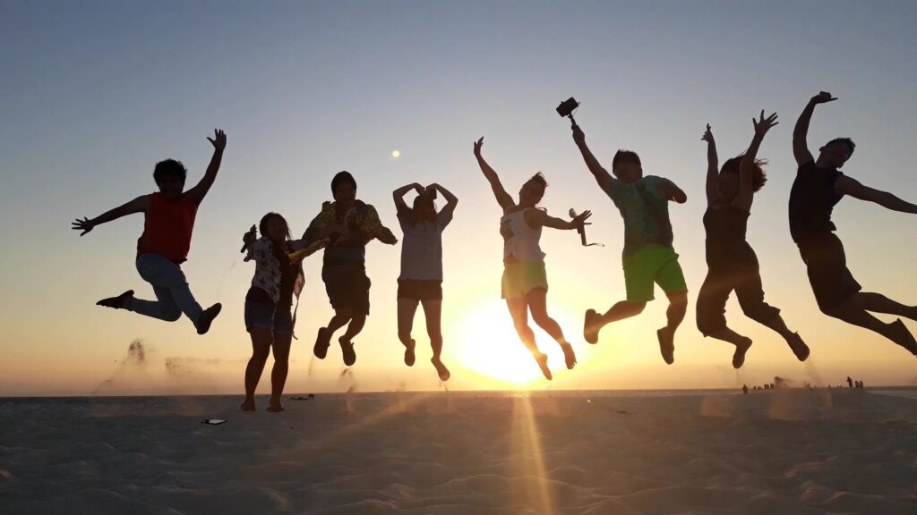 A group of people doing jumpshot