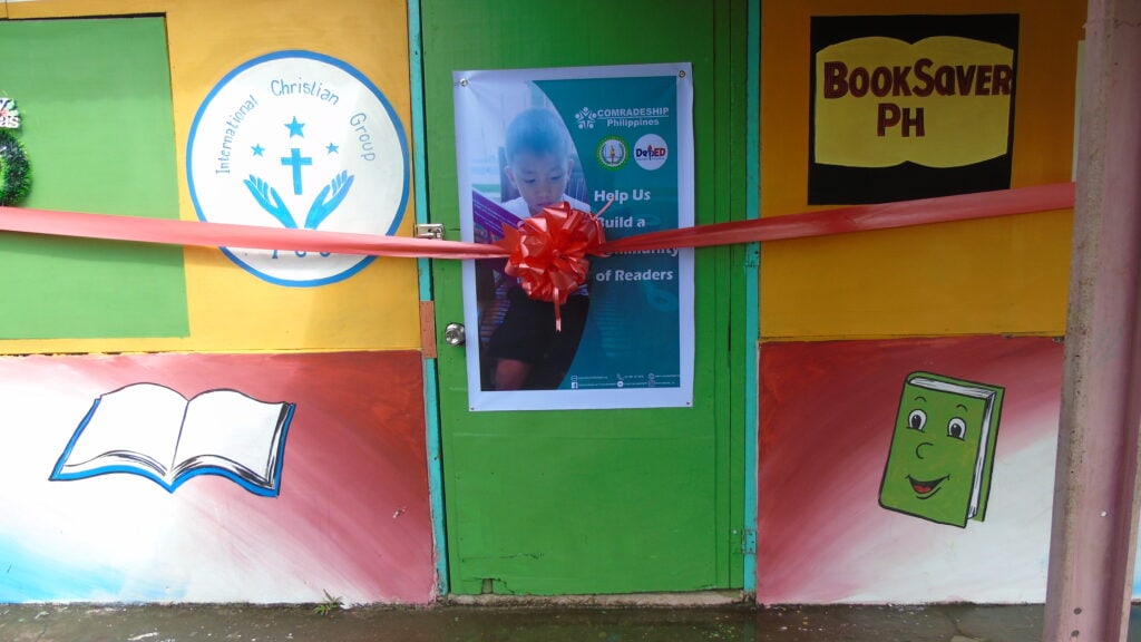 A close room with a ribbon to cut in the door