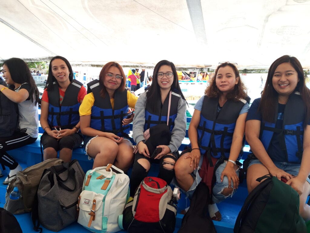 A group of people wearing life jacket